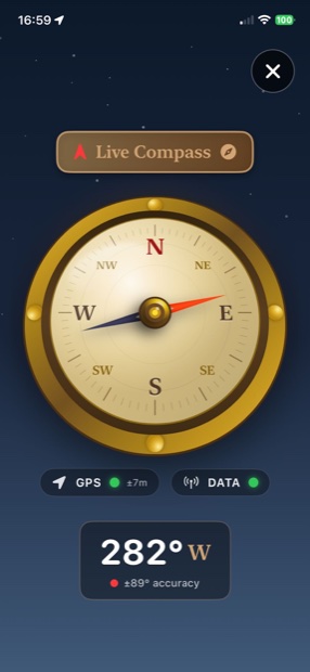A live brass compass overlaid on the map